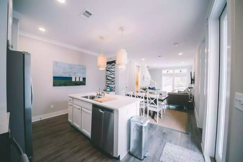 Open kitchen with island, dining and living area