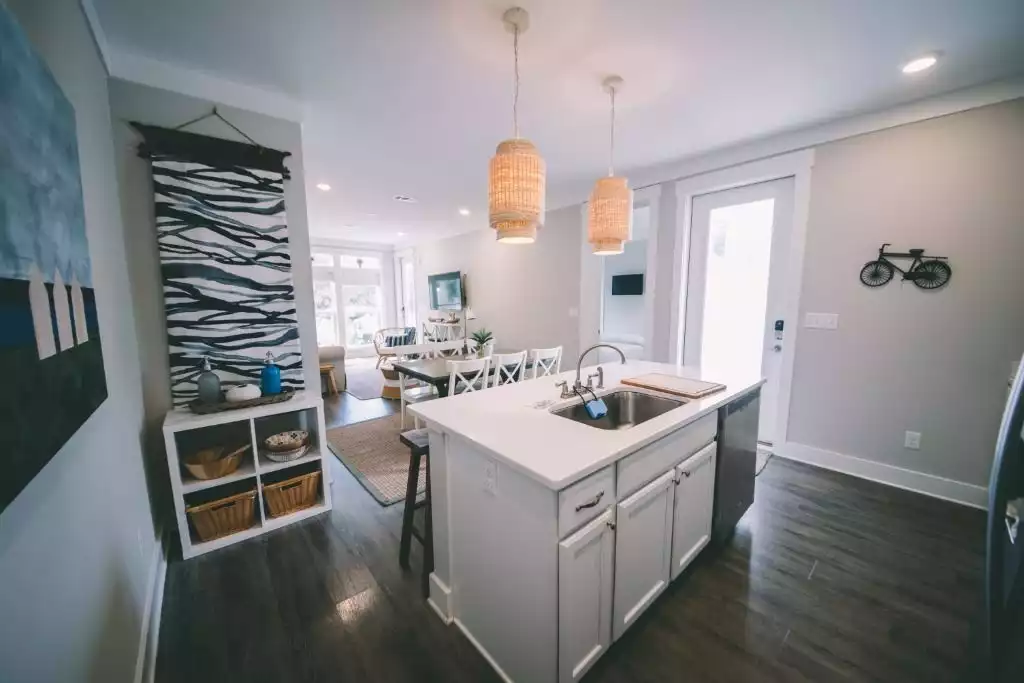 Kitchen with white cabinets and deck access